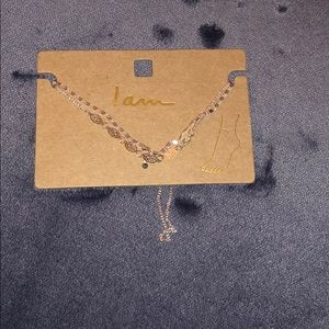 A gold two chained ankle bracelet